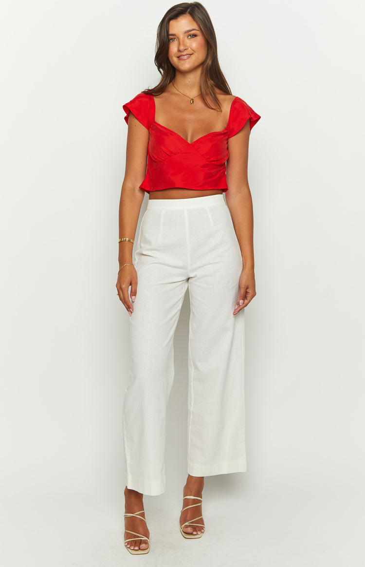 Red crop top with a sweetheart neckline, fitted bodice, and short ruffled cap sleeves