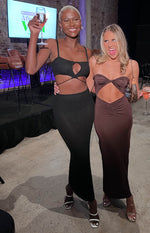 Black knitted crop top with keyhole cutout, spaghetti straps, and wrap-around waist ties