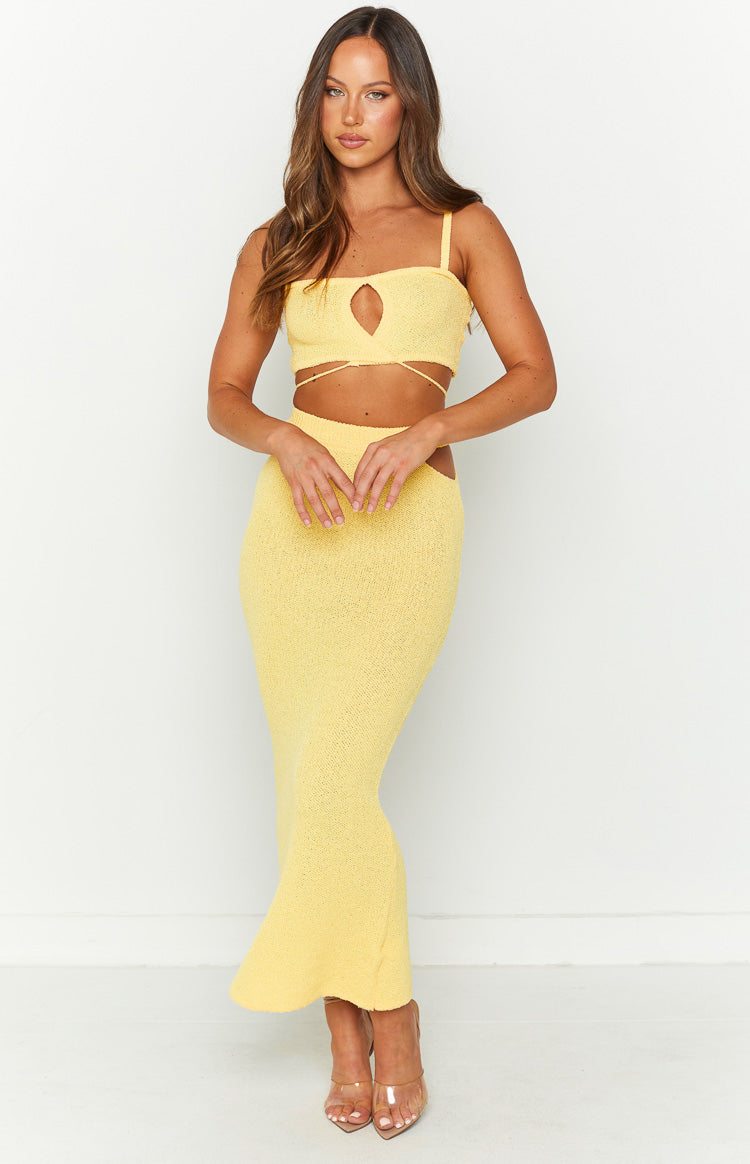 Rear view of a yellow textured knit crop top with thin spaghetti straps