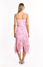 Back view of a pink sequin midi dress with thin straps, square back, floral sequin pattern, and a ruffled handkerchief hem