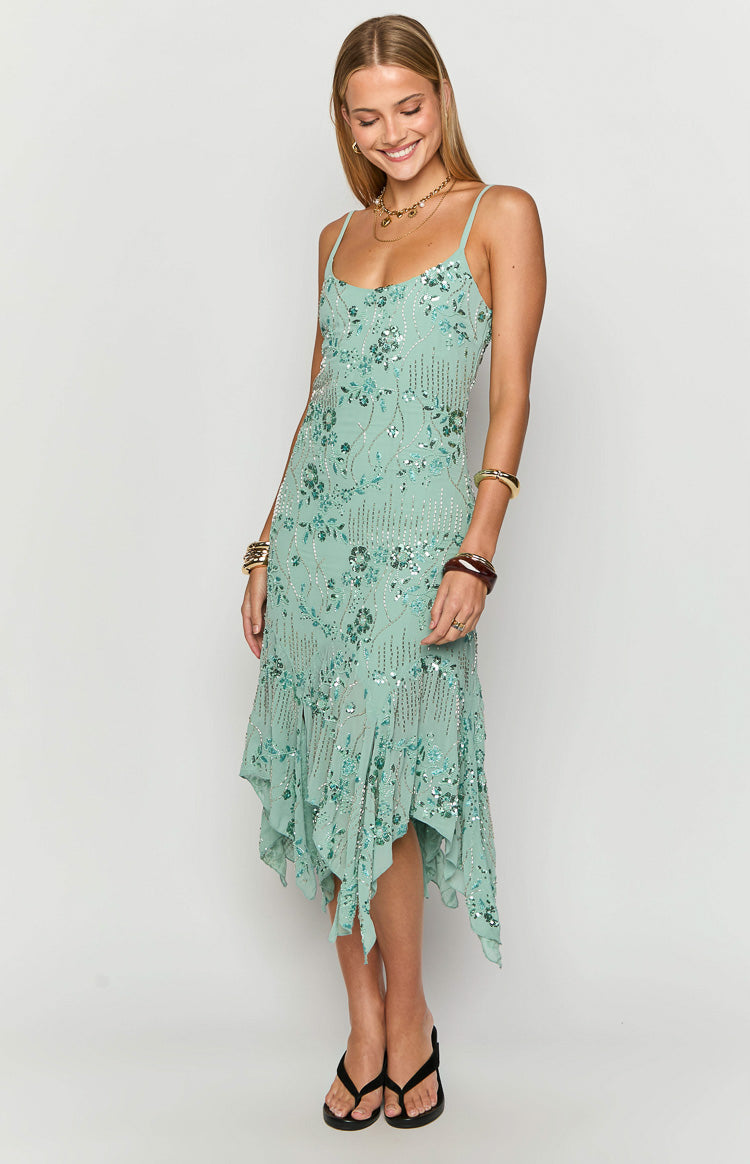 Teal sequin midi dress with spaghetti straps and a flowing handkerchief hem