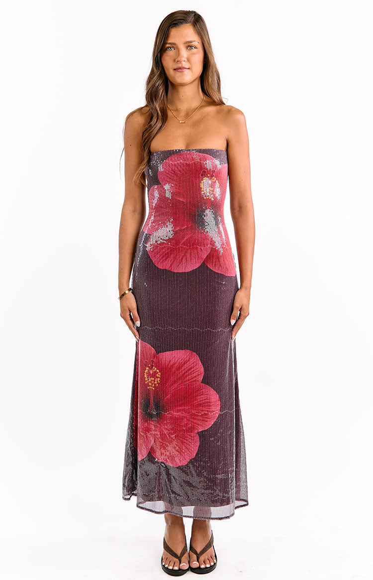 Front view of a wine sequin strapless maxi dress featuring a vertical ribbed texture and red hibiscus flowers