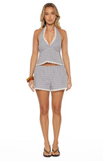 Front view of a blue plaid halter neck top with white lace trim on the V-neck and cropped hem
