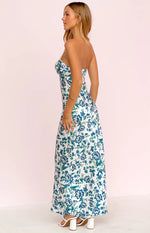 Side view of the white floral maxi dress with a strapless sweetheart neckline and flowing skirt