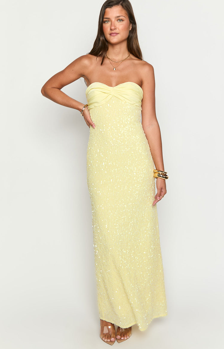 Fitted yellow sequin strapless maxi dress with a twisted bodice and floor-length hem