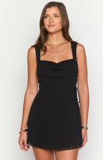 Black chiffon mini dress with a ruched bust, square neckline, and delicate side tie detail