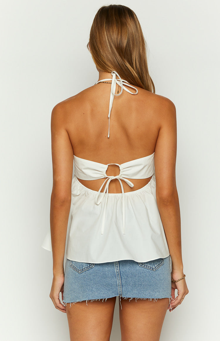 Rear view of a white halter top showing the tie-back closure, open back, and gathered hem
