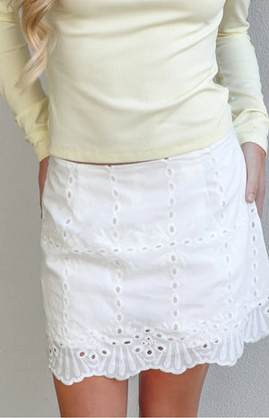 Beginning Boutique Ayla White Broderie Mini Skort white broderie anglaise mini skort with eyelet details and a scalloped hem
