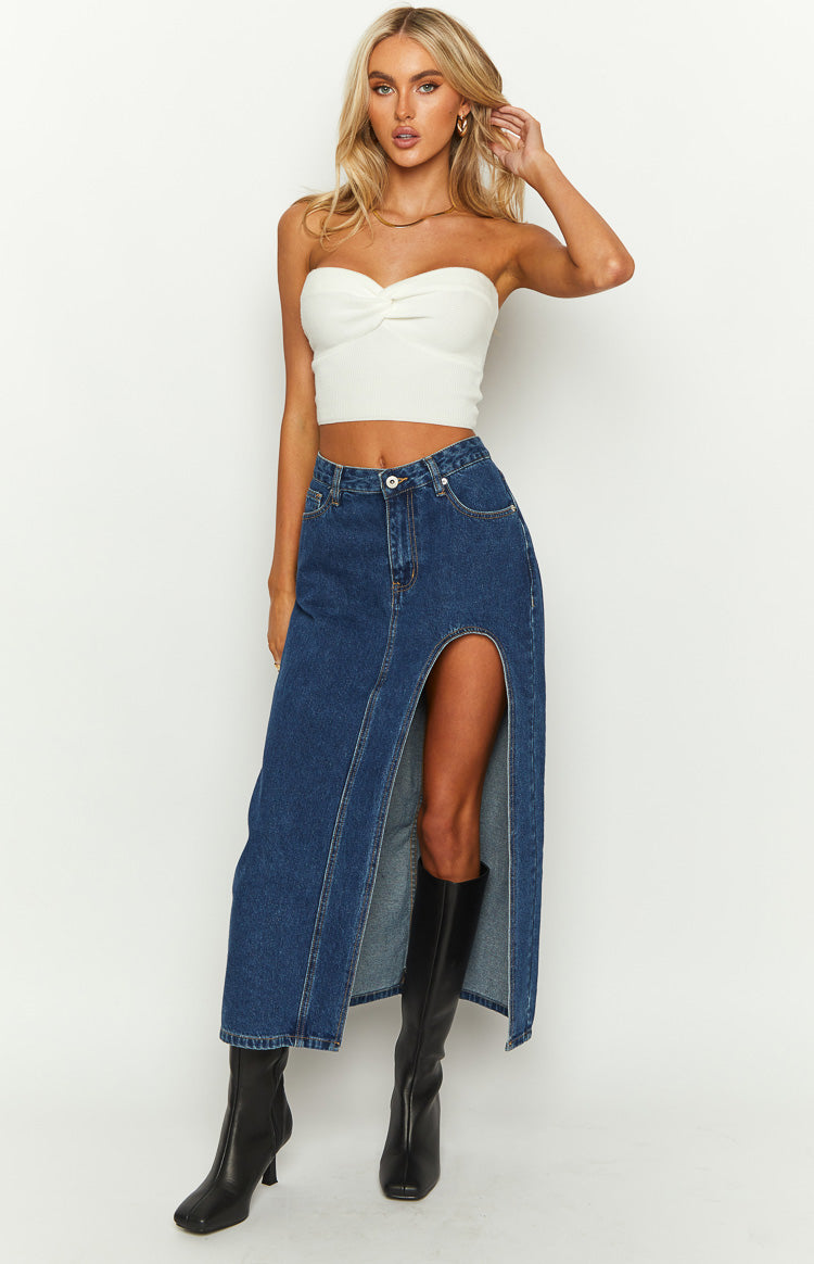 Dark wash denim midi skirt with a high front split and straight fit