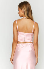 Rear view of the pink satin corset top with a gold back zipper and adjustable spaghetti straps
