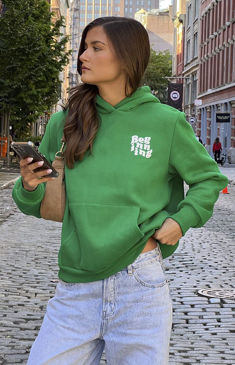 Beginning Boutique Beginning Green Snuggle Bubble Hoodie oversized green hoodie with white 'Beginning' text, front pouch pocket, and ribbed cuffs