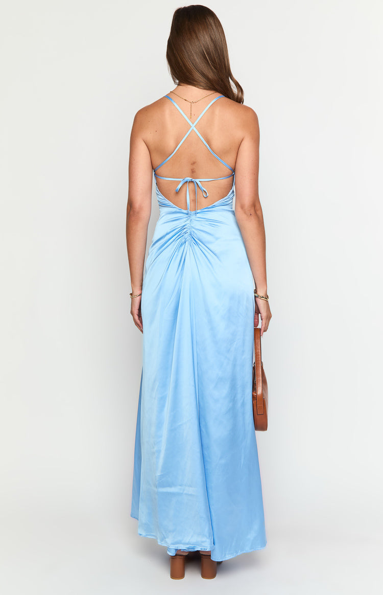 Rear view of a light blue satin maxi dress with criss-cross tie-back straps and ruched detail