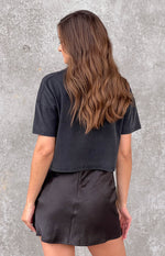 Washed black short sleeve tee, cropped length with a relaxed fit