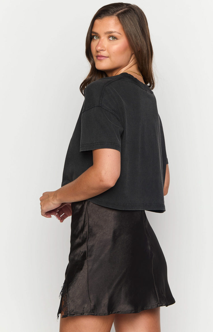 Washed black cotton tee with a relaxed fit, short sleeves, and a cropped hem