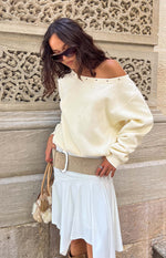 Beginning Boutique Bambi Cream Asymmetric Neckline Eyelet Sweater cream oversized sweater with an asymmetric off-shoulder neckline and eyelet detail
