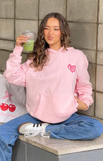 Beginning Boutique Beginning Pink Lovey Bubble Hoodie pink oversized hoodie with a hood, front pouch pocket, and a pink heart graphic on the chest