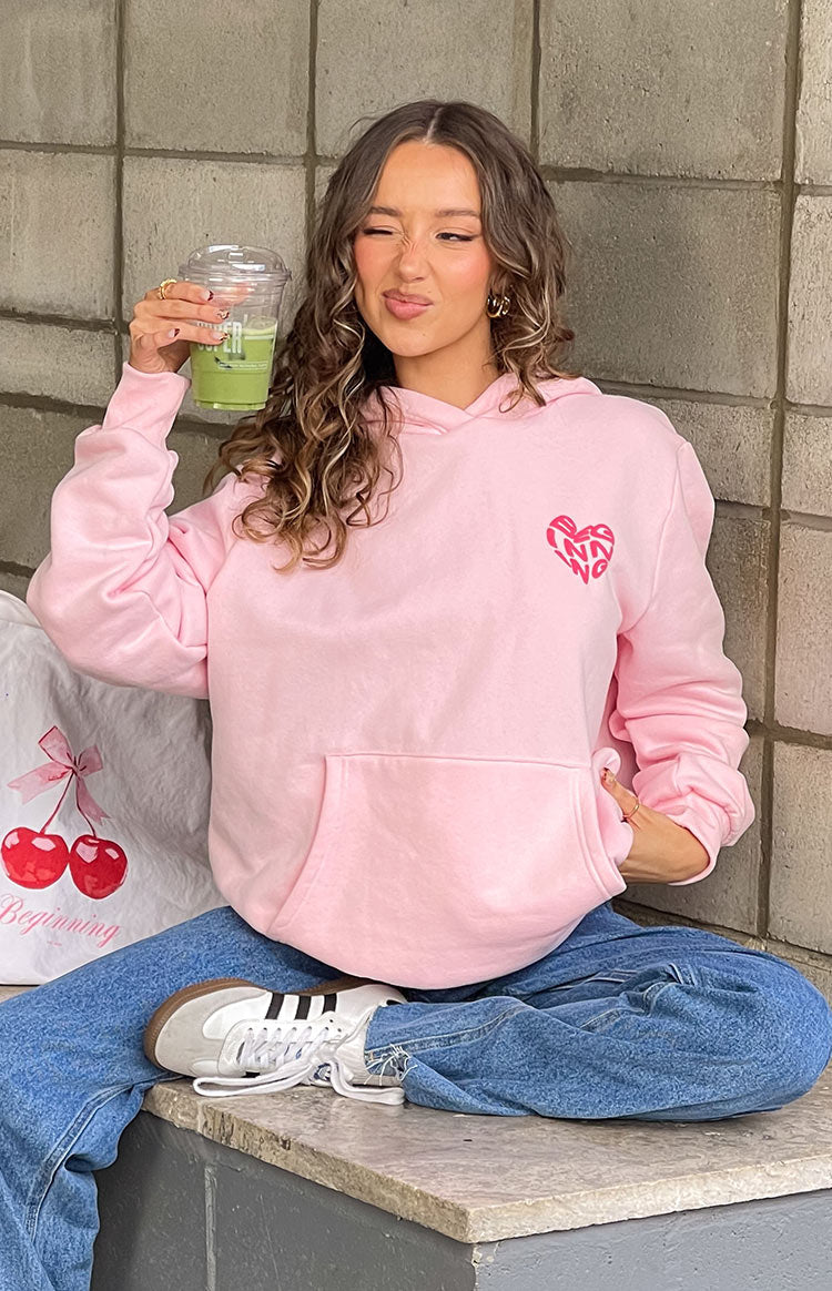Beginning Boutique Beginning Pink Lovey Bubble Hoodie pink oversized hoodie with a hood, front pouch pocket, and a pink heart graphic on the chest