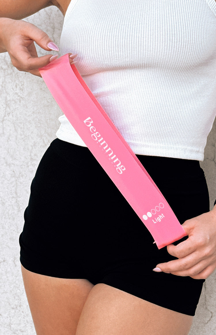 Beginning Boutique Resistance Bands pink resistance band with white Beginning logo and 'Light' resistance level