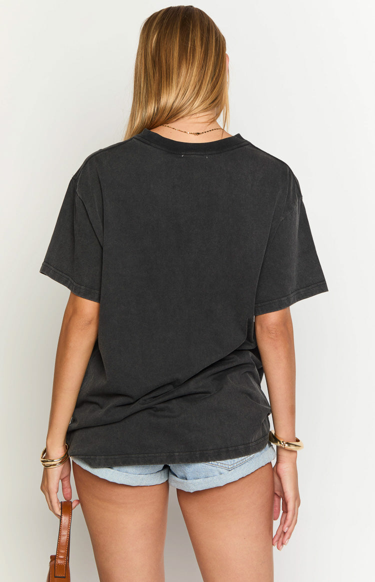 Rear view of a washed black oversized tee with a crew neck and short sleeves