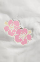 Girl in a car with a hanging pink flower air freshener