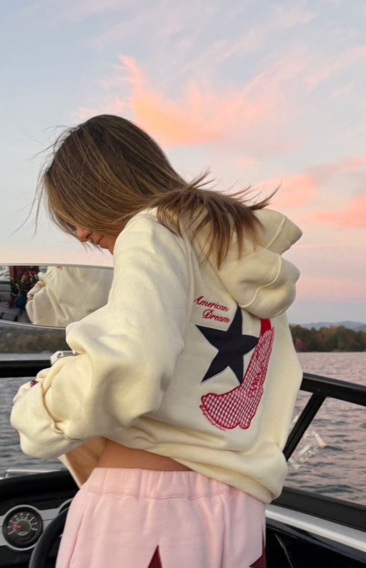 Beginning Boutique Beginning Cream American Dream Hoodie cream hoodie with a hood and back graphic 'American Dream', black st