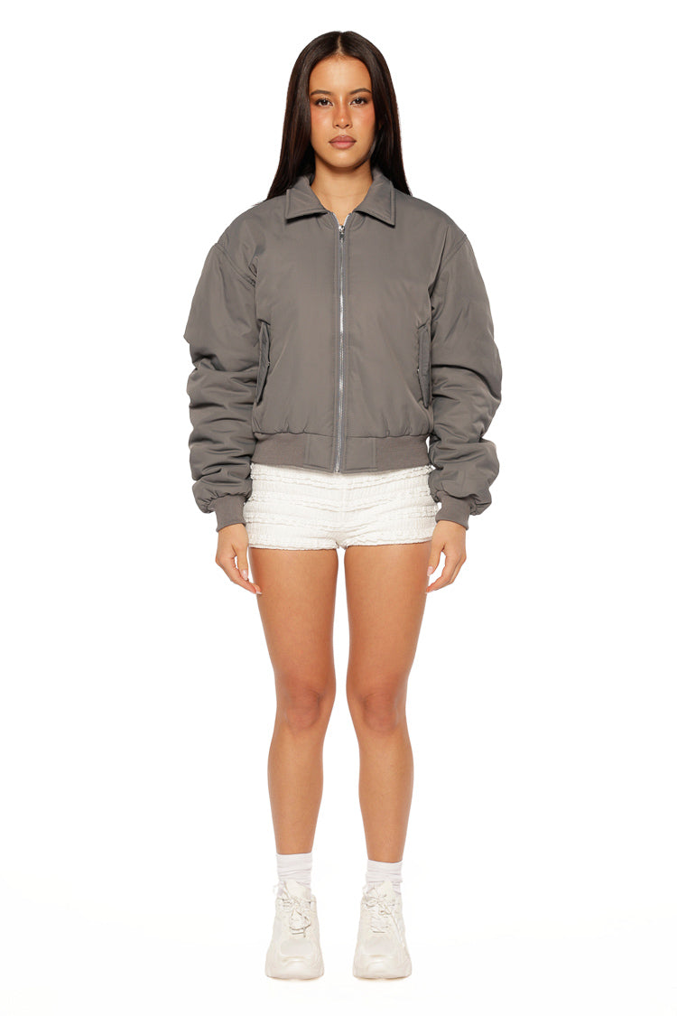 Relaxed fit grey bomber jacket with voluminous sleeves, a pointed collar, and ribbed waist and cuffs