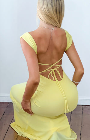 Beginning Boutique Beverley Yellow Mesh Maxi Dress yellow mesh maxi dress with an open back, criss-cross tie straps, and shor