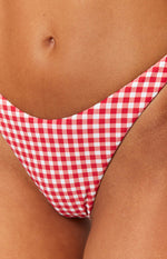 Front close-up of the red gingham bikini bottoms showing the high-cut leg
