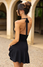 Front view of a black mesh mini dress with a draped cowl neckline and fitted ruched waist