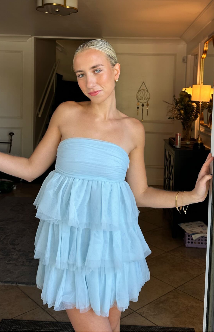 Light blue strapless mini dress with a ruched bodice and tiered tulle skirt