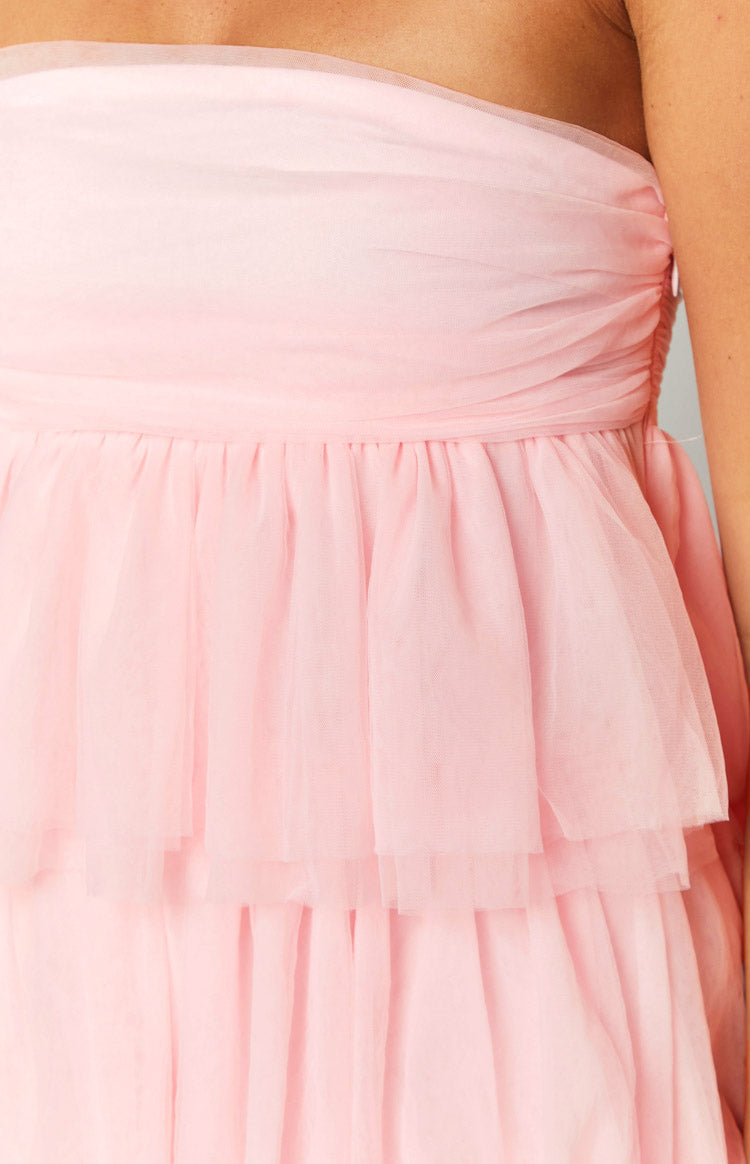 Close-up of the pink tulle mini dress showing the ruched bodice and tiered ruffle skirt