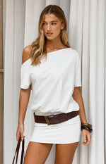 Beginning Boutique Bisou White Off Shoulder Mini Dress white off-shoulder mini dress with a relaxed blouson top and fitted sk