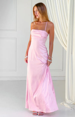 Beginning Boutique Blaise Pink Satin Maxi Dress pink satin strapless maxi dress with thin spaghetti straps and a gathered bus