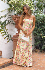 Yellow bloom satin maxi dress with a straight neckline and thin spaghetti straps