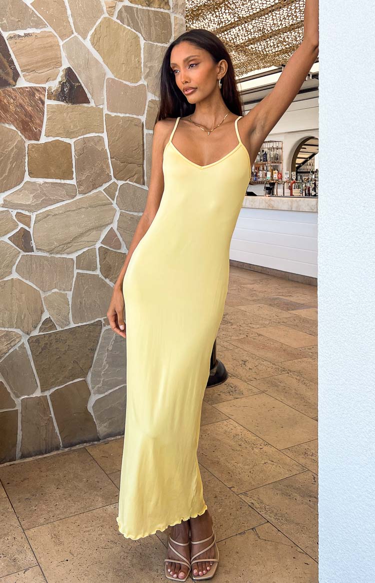 Yellow fitted V-neck maxi dress with thin spaghetti straps and lettuce hem