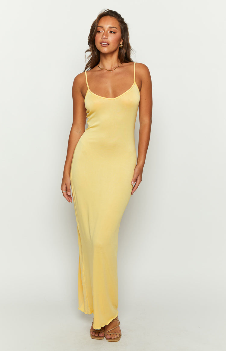 Close-up of a yellow lace maxi dress with a V-neckline and ruffled cap sleeves