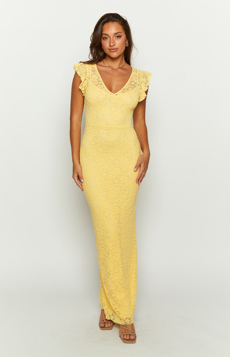 Front view of a yellow V-neck maxi dress with thin spaghetti straps and a side slit