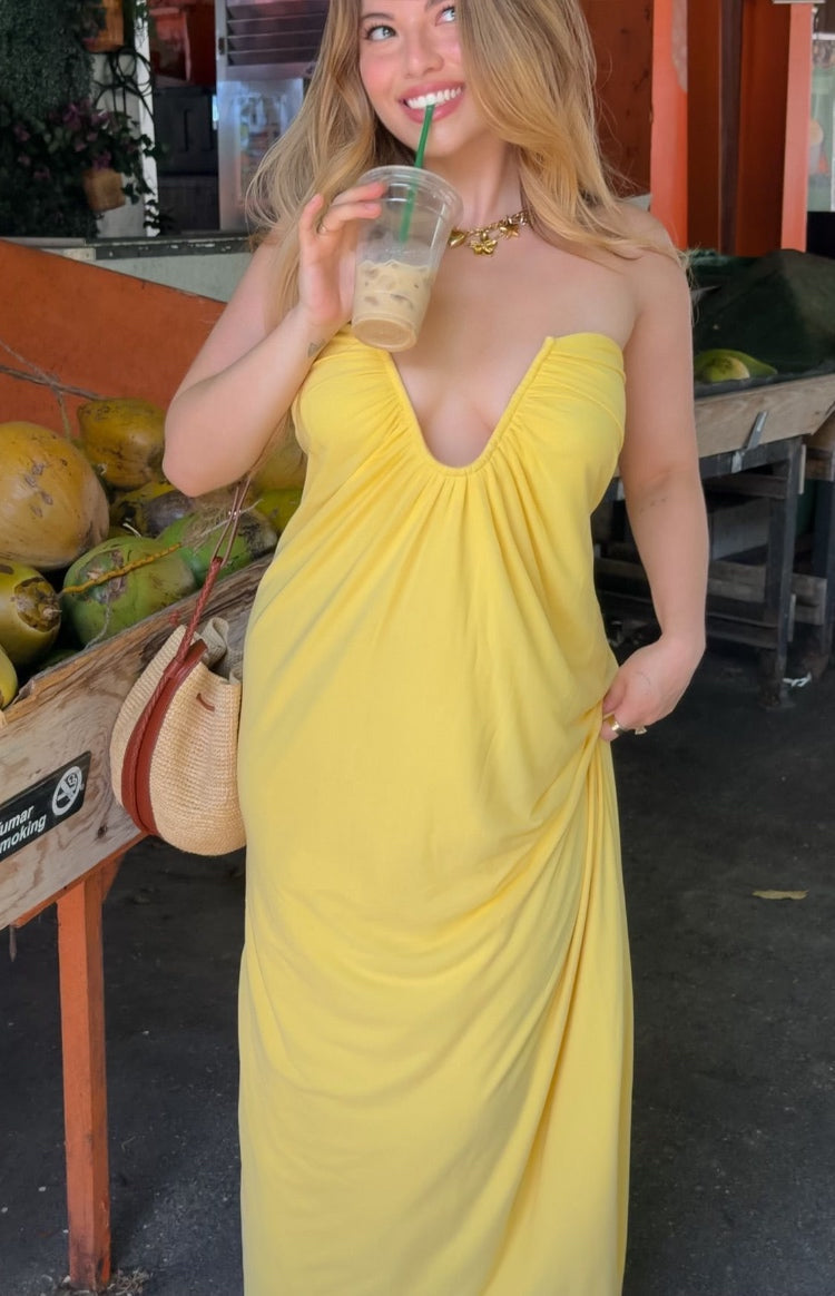 Yellow jersey strapless maxi dress with a deep V-neckline, gathered bust, and a relaxed flowy fit