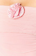 Close-up of a pink floral appliqué detail on the ruched pink mesh mini dress