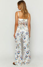 Rear view of white satin wide-leg pants with a colourful Italia print and a flat back waist