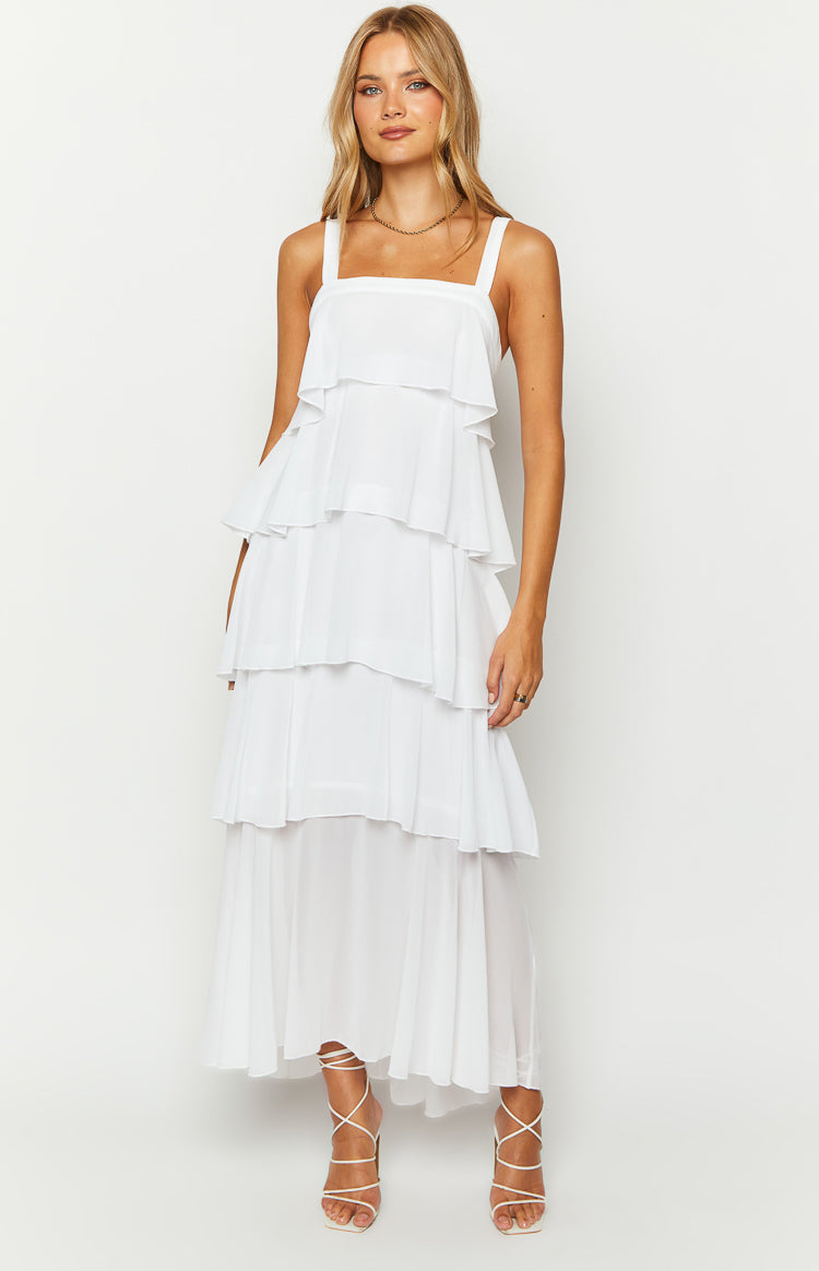White maxi dress with a square neckline, wide straps, and multiple tiers of flowing frills