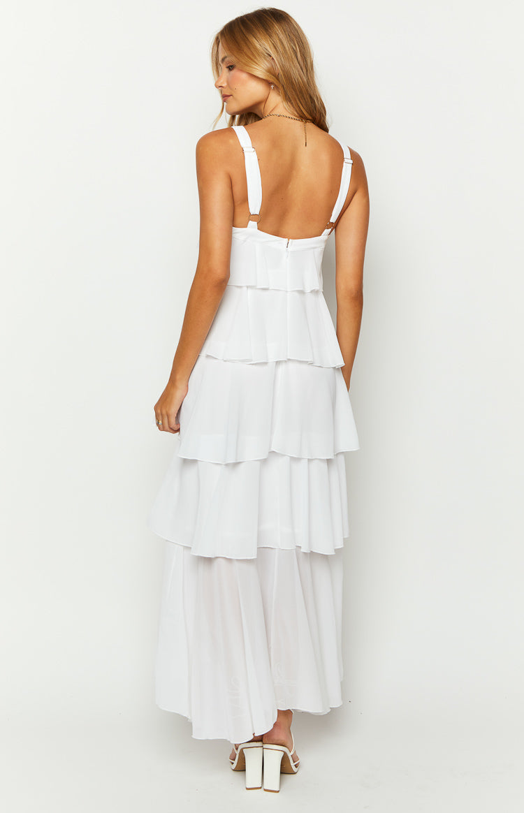 Rear view of a white layered frill maxi dress with adjustable shoulder straps and a back zipper closure