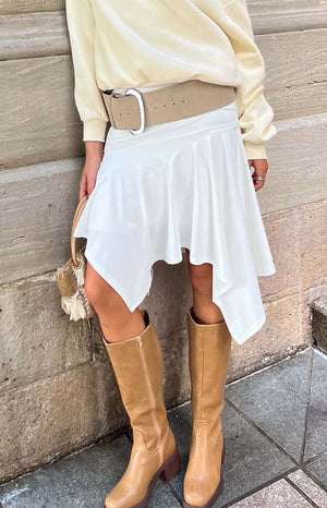 Beginning Boutique Brighton White Asymmetrical Midi Skirt white flowy asymmetrical midi skirt with a draped hem