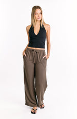 Brown striped wide-leg pants with an elasticated drawstring waist and side pockets