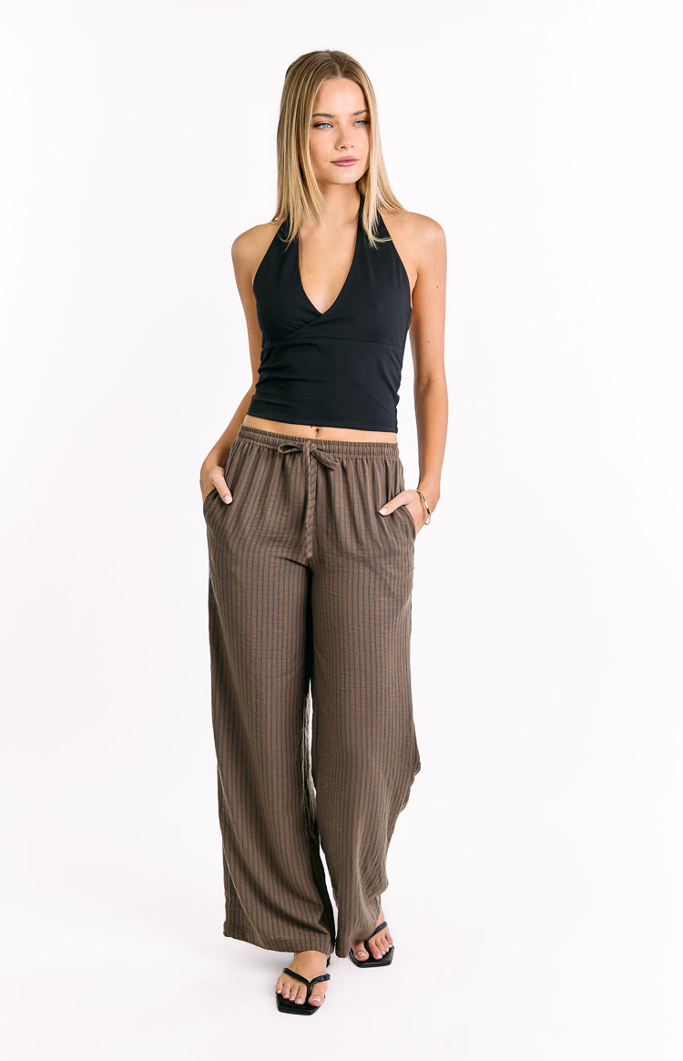 Brown striped wide-leg pants with an elasticated drawstring waist and side pockets