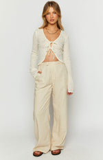 Front view of cream linen blend wide-leg pants with a high waist and side pockets