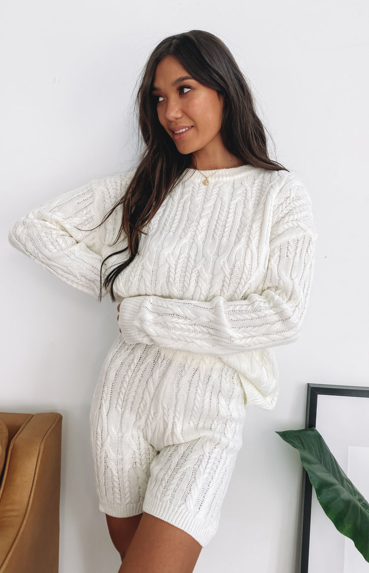 Cream cable knit shorts with ribbed cuffs, styled with a matching long sleeve crew neck sweater