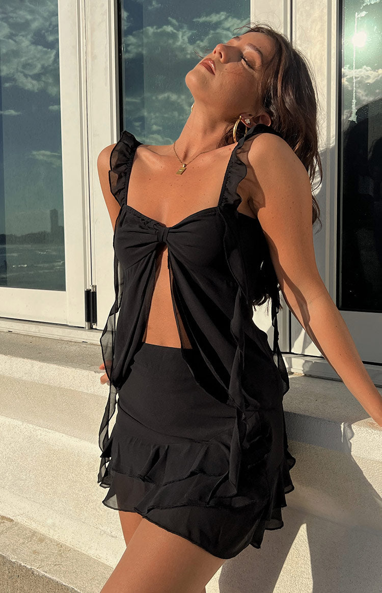 Beginning Boutique Caspian Black Chiffon Top black chiffon top with ruffled straps bow detail and front cutout
