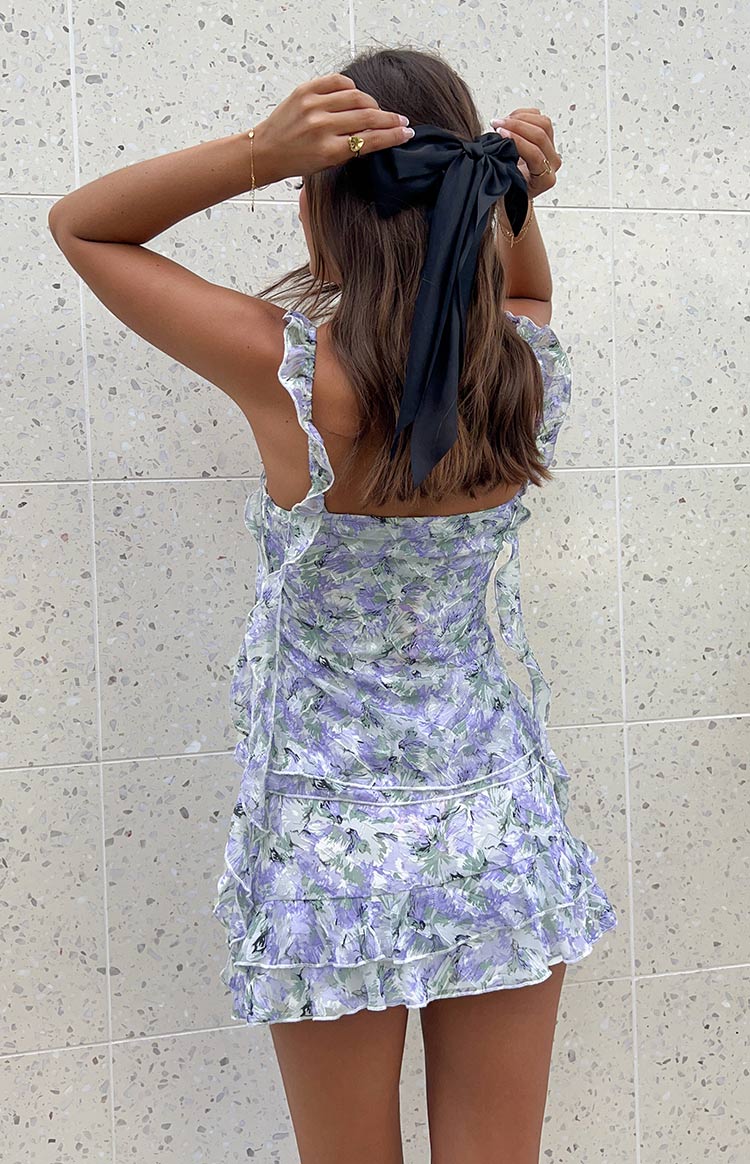 Rear view of a purple floral print chiffon mini skirt with tiered ruffles