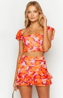 Beginning Boutique Caspian Azalea Pink Print Chiffon Mini Skirt azalea pink and orange abstract print chiffon mini skirt with ruffled hem